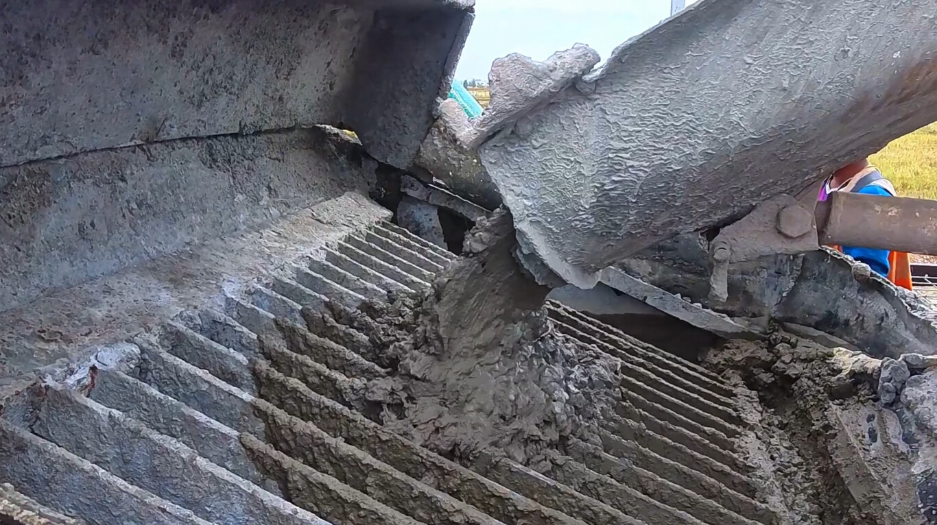 Professional concrete truck pouring fresh concrete for residential project in Opelika, AL